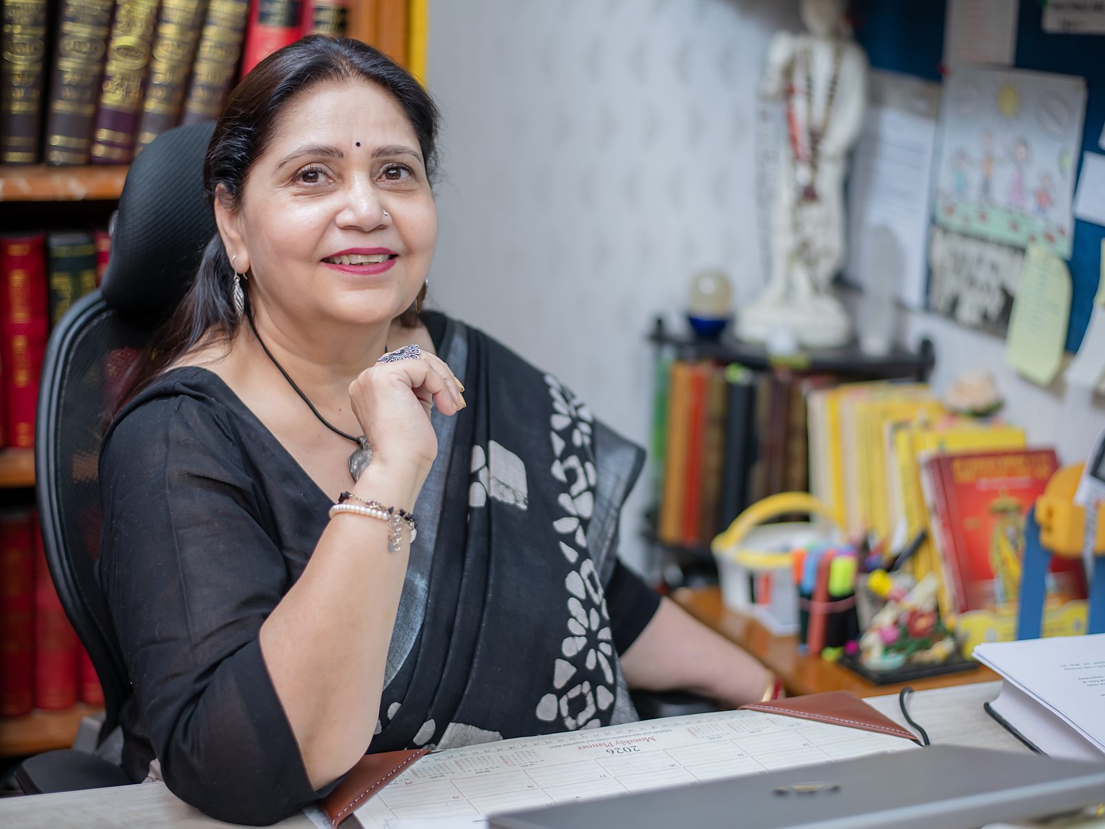 Kiran Ashri at her desk